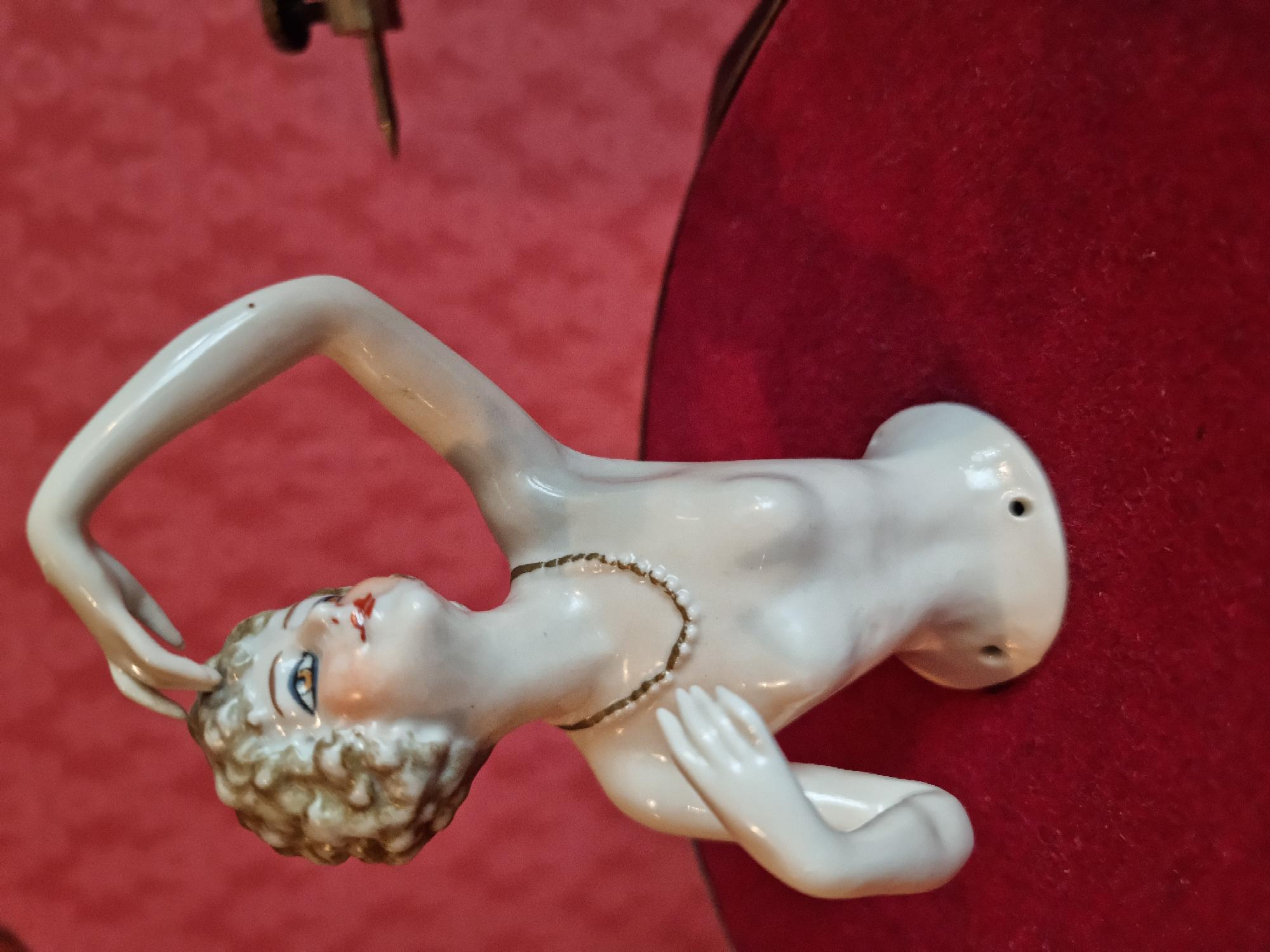 Figurine mounted on red turntable