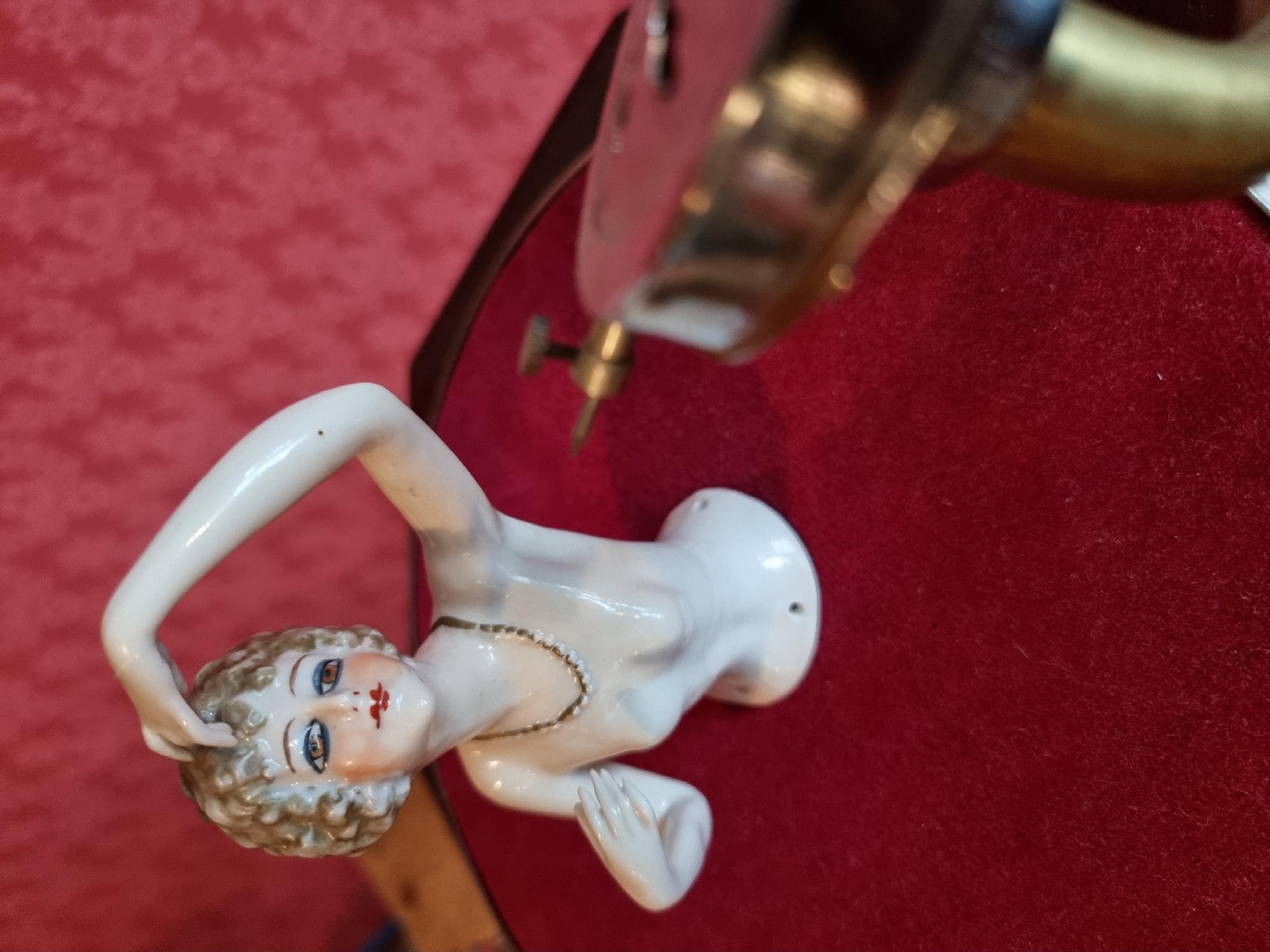 Close-up of figurine and gramophone head
