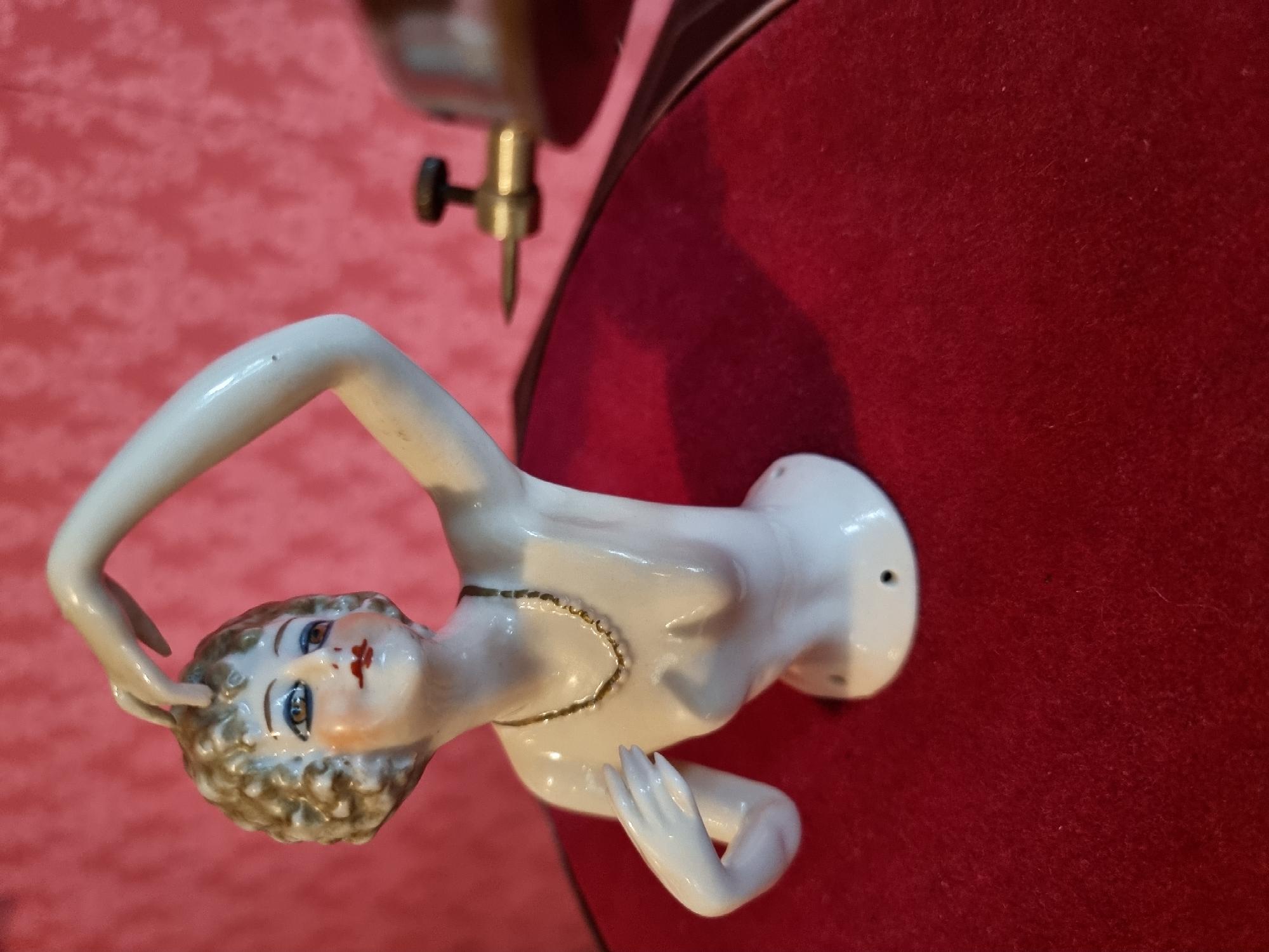 Close-up of figurine under gramophone head
